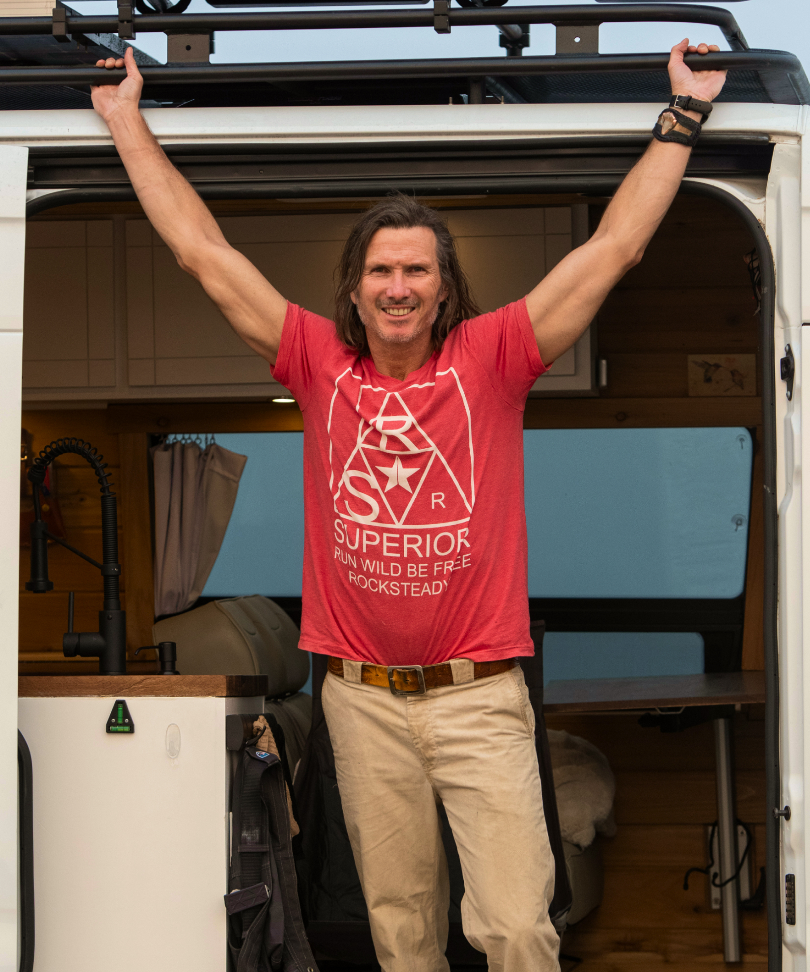 Jon Sabes celebrating at his camper van